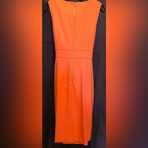 Calvin Klein,Size 10, Orange Dress, Sleeveless, Gold Zip on back. Hits at knee.